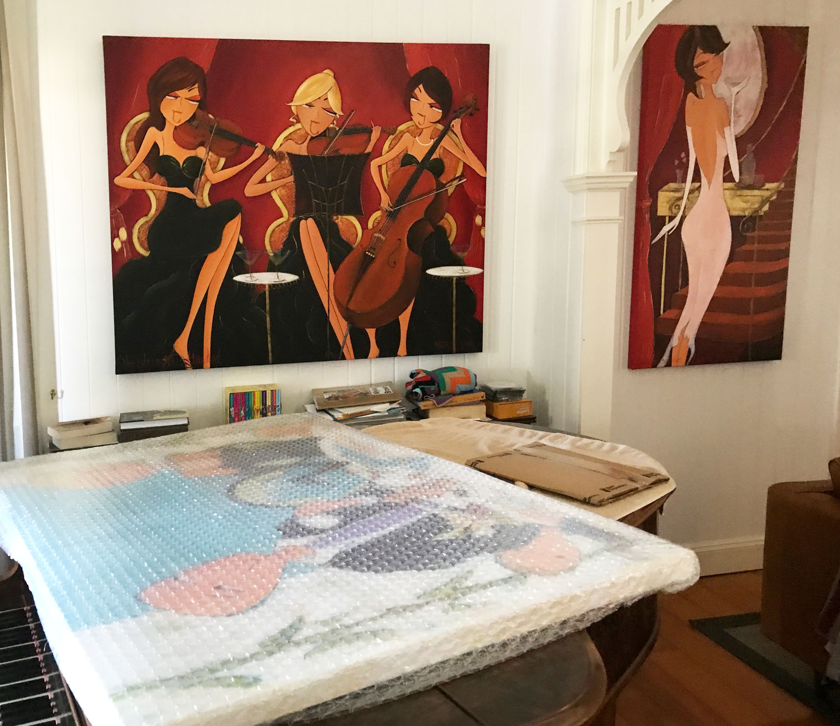 Mornings at the Browns still wrapped on the table the day Natalie delivered it, with two of her earlier originals, No Strings Attached and Goodnight Sweetheart, already hanging on the walls